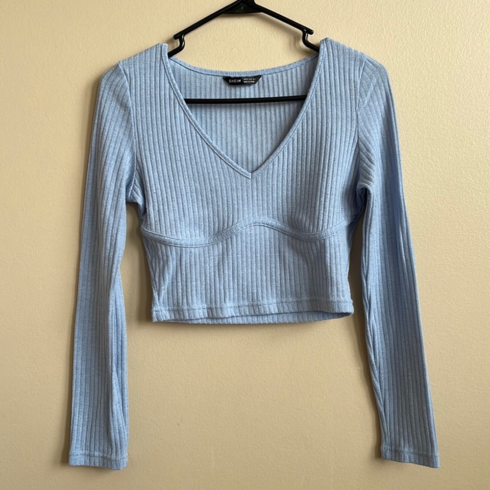 Sky blue long sleeve shirt. It’s a size medium from SHEIN.